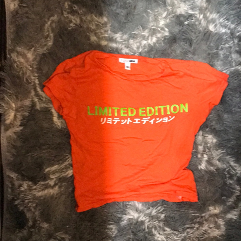 Bright orange shirt with neon writing